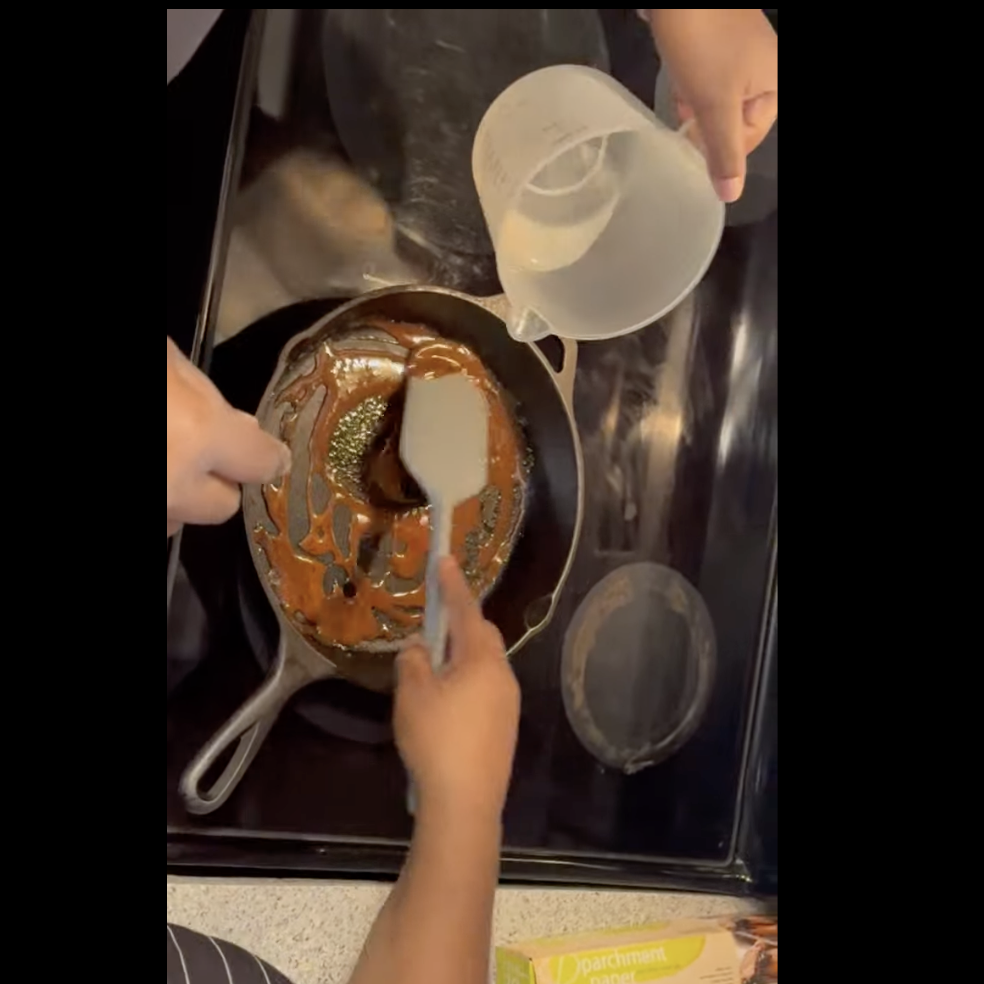 Cast-iron skillet with burnt sugar — the Black Cake Framework in practice